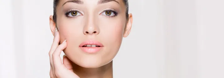 Close-up facial beauty image of a woman highlighting clear skin and smooth texture.